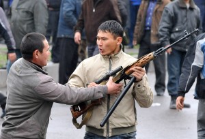 Kyrgyz opposition supporters vie for a g